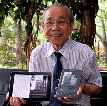 Spreading the digital word: Takuma Fukuyama displays the digital version of his book No More Hiroshima Nagasaki on his iPad 2 and Kindle e-reader during an interview in late July with The Japan Times in Tokyo. War memoirs digitized for posterity